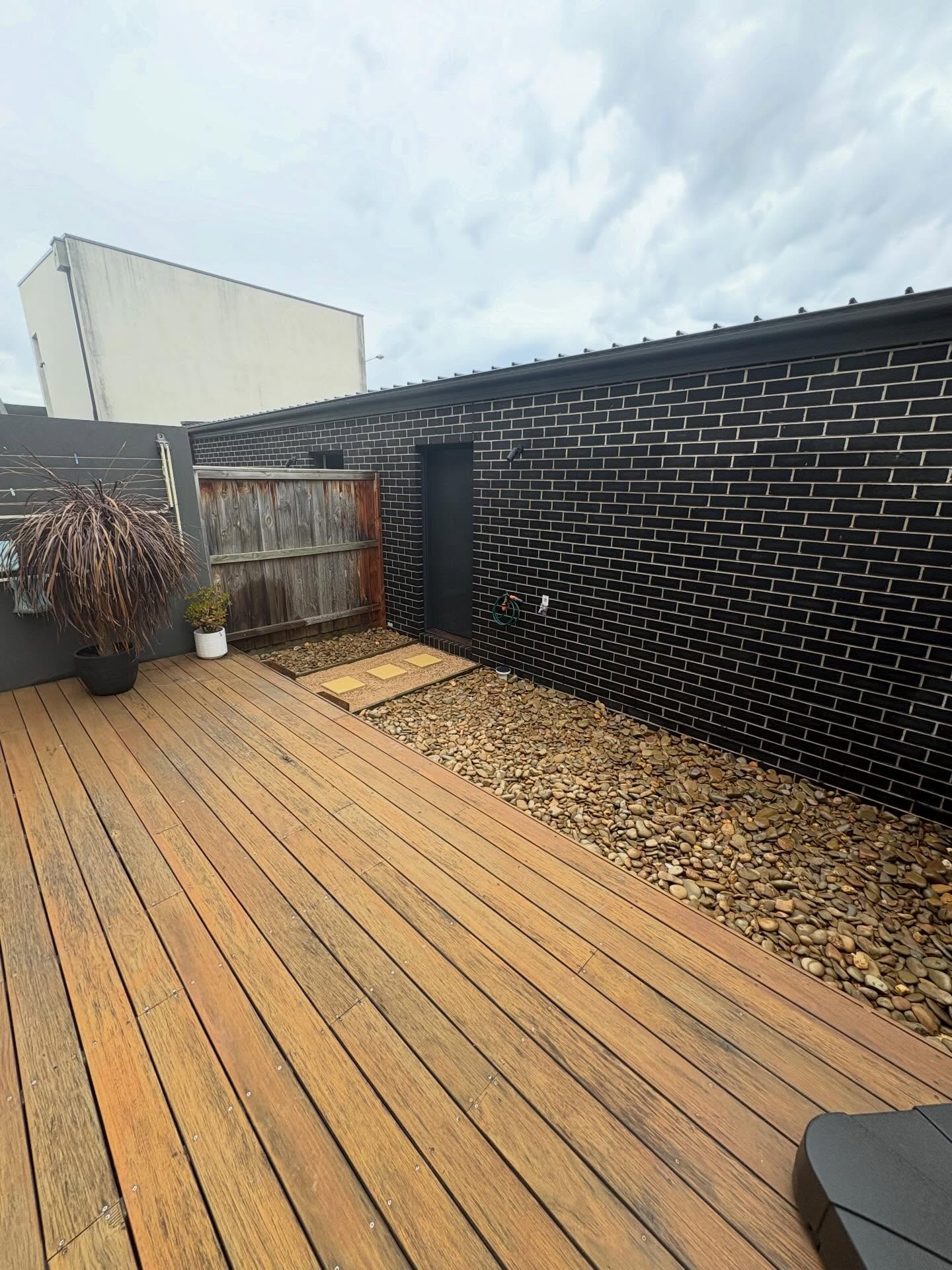 Timber decking with pebble border